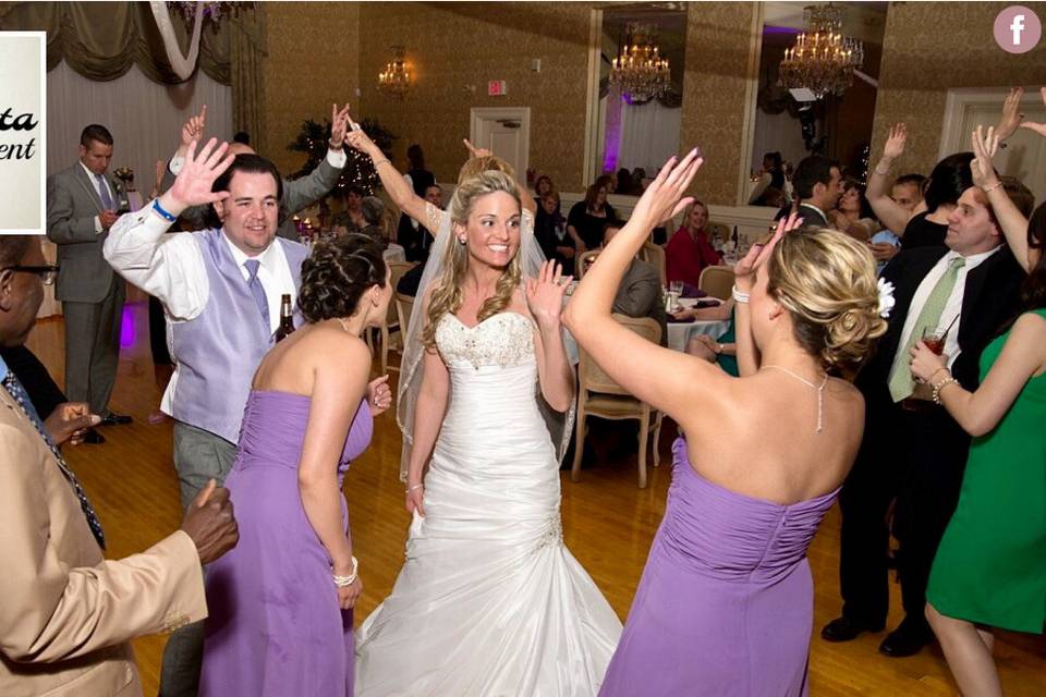 Newlyweds and guests on the dance floor