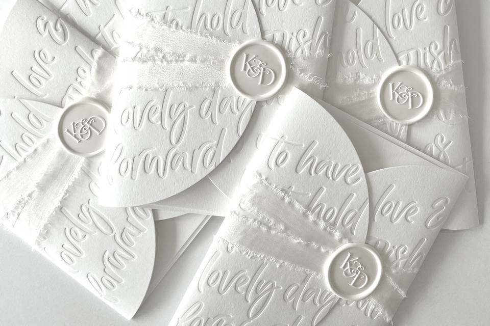 Embossed wedding invitations
