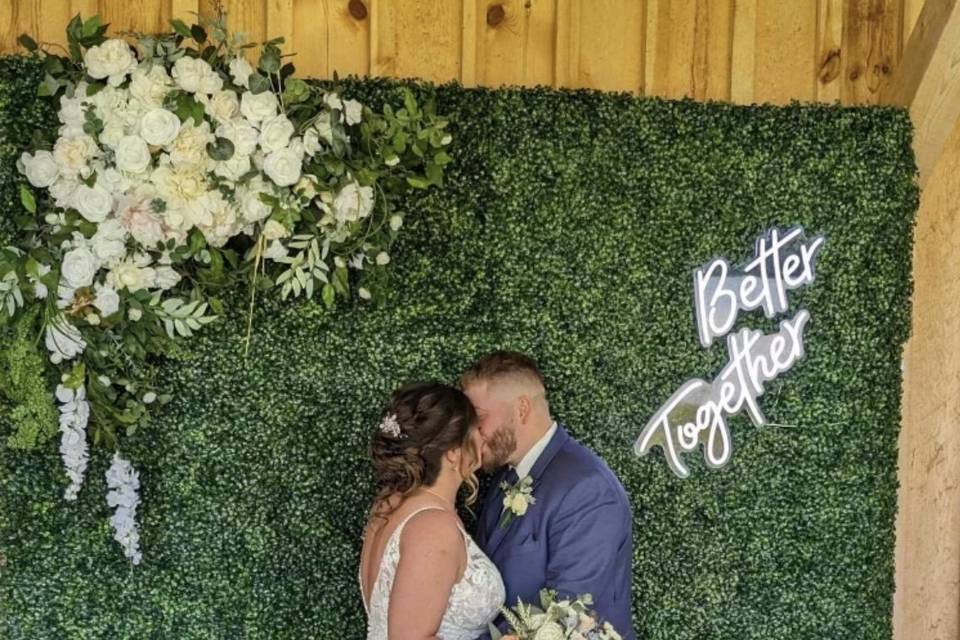 Kiss by Boxwood Wall