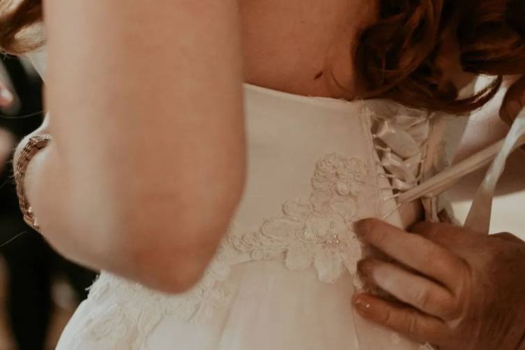 Lacing up a wedding gown
