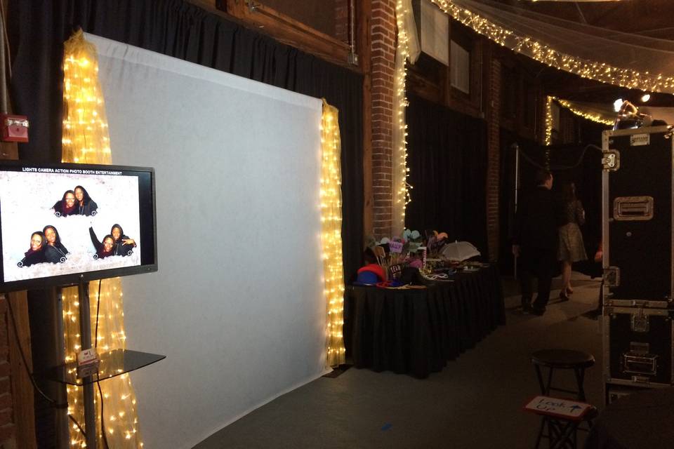 Typical setup: backdrop, 8ft table for all the fun props, monitor to stream all the pictures live as they are taken, and the photo booth. If we are compiling your keepsake wedding album, then we will use a tall round cocktail table.