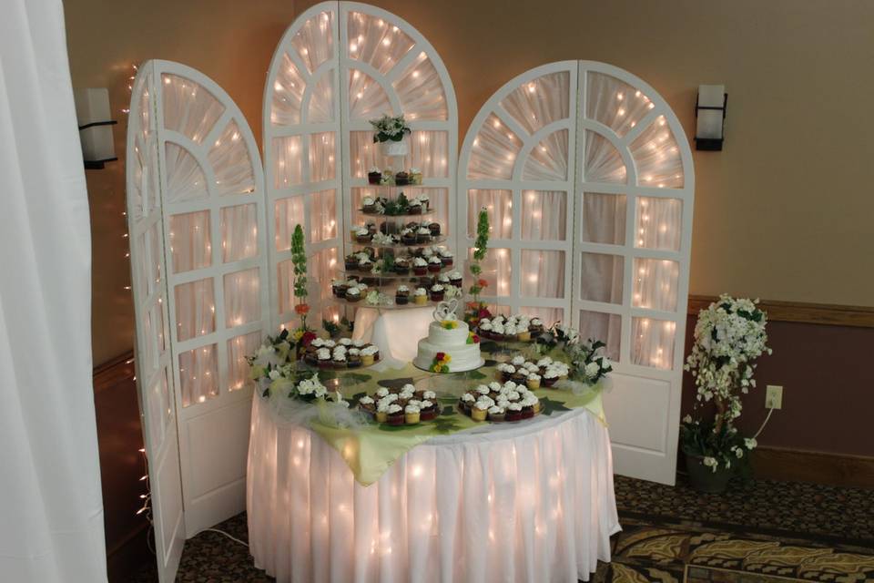 Wedding cake and cupcake table