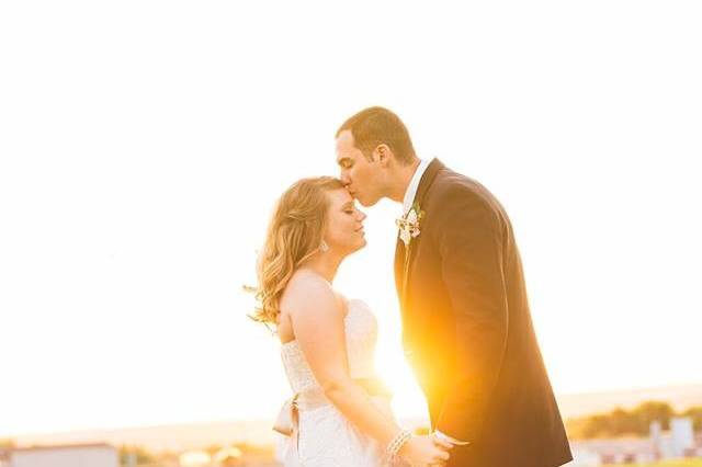 Couple kissing at sunset