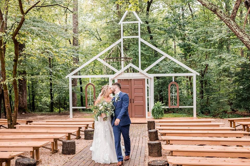 Bride and groom in field