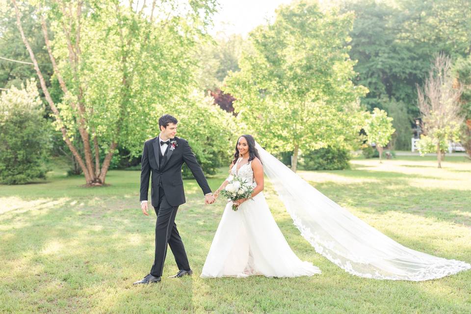 Bride and groom in field