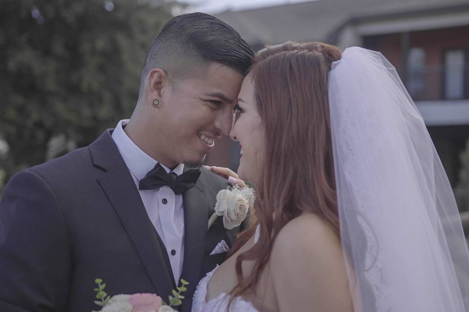 Bride and groom kissing under the altar