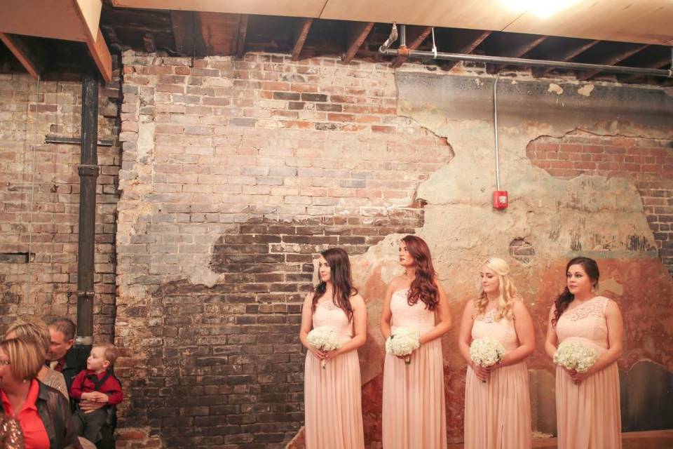 Bridesmaids by the old wall