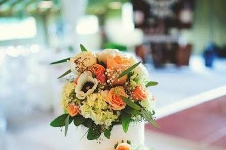 Buttercream raked cake with fresh flowers