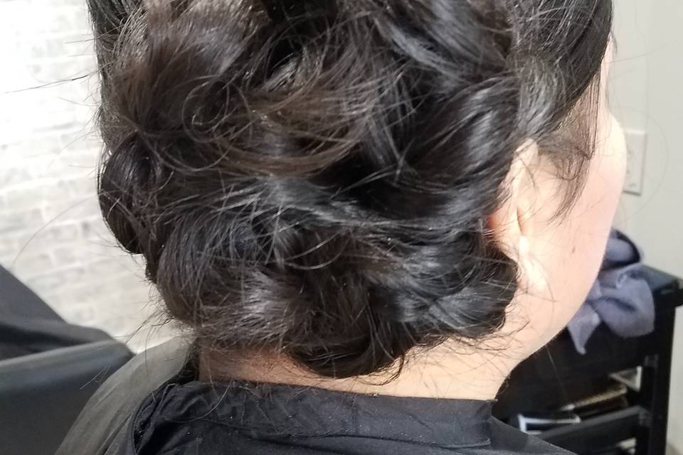 Low curly side-bun