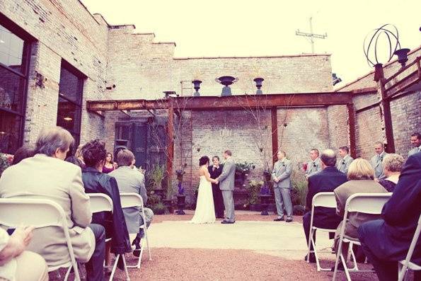 Ceremony at Blumen Gardensphoto by Kristin Kasperek of iKliKphoto