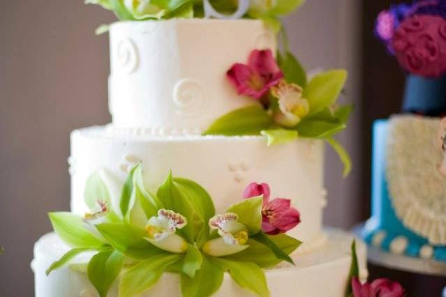 Three-tier wedding cake with flowers