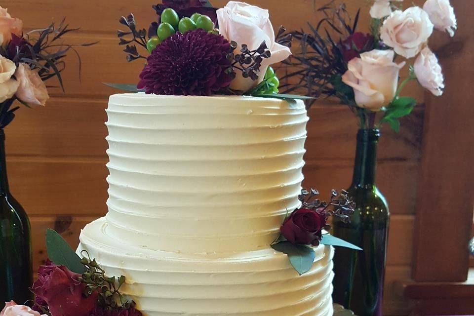 Two-tier wedding cake with flowers