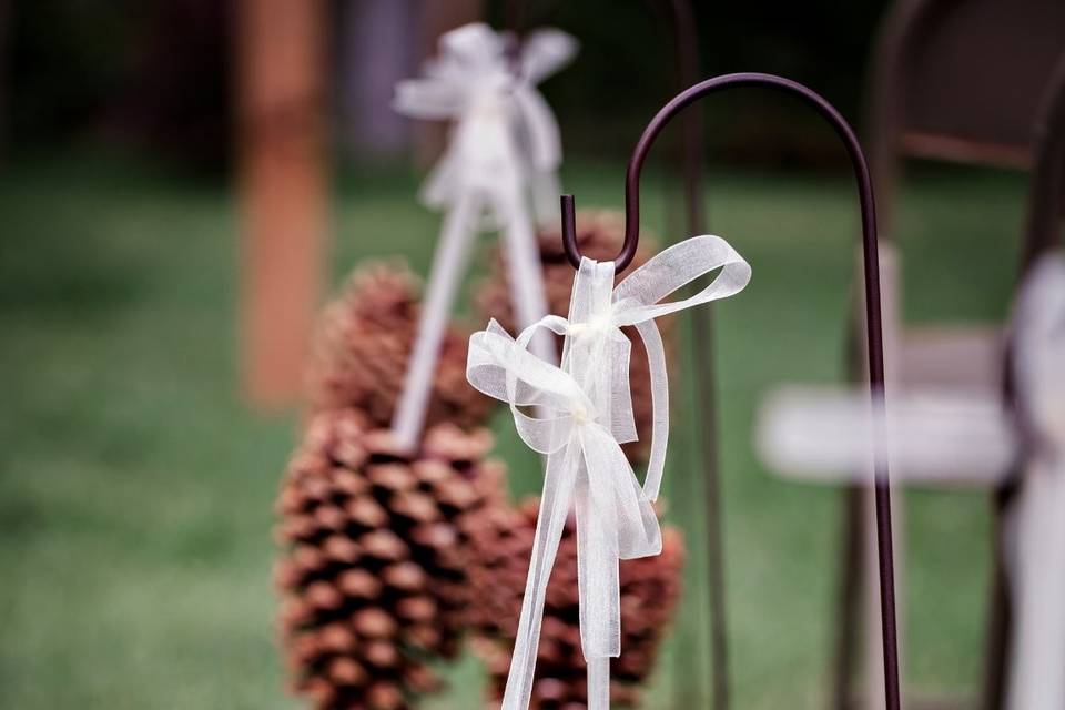 Pine cone aisle decor