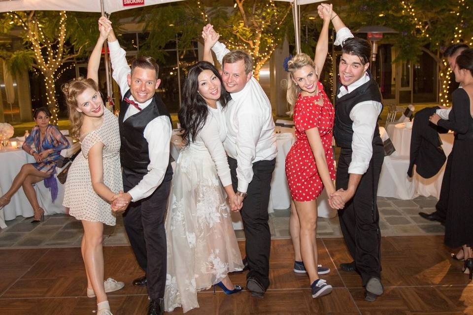 Newlyweds and guests on the dance floor