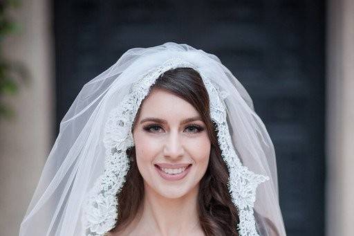 Sleeved bridal gown and veil
