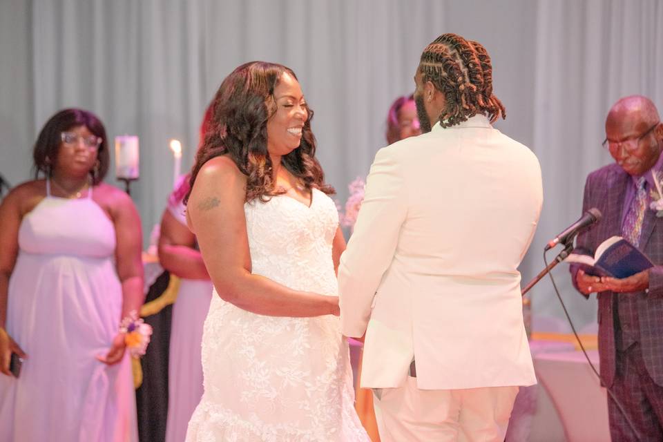 Bride smiles at groom