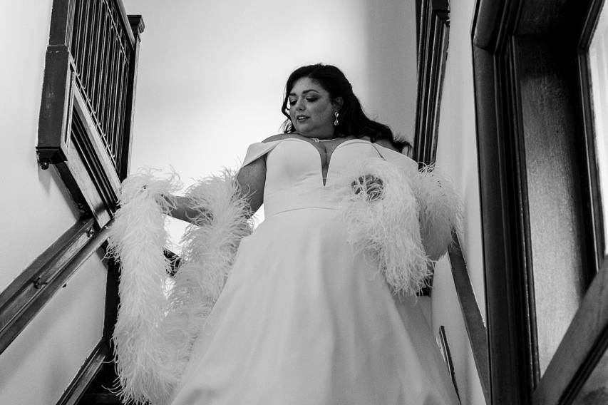 Bride walks down staircase