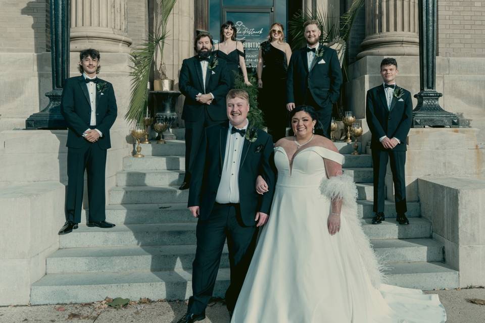 Wedding party posing on stairs