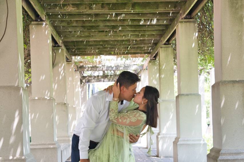 Couple kiss leaning
