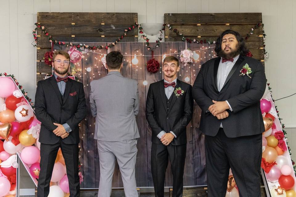 Groom faces wall others look