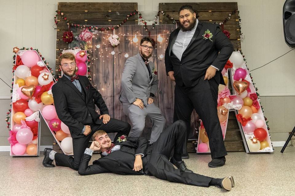 Groomsmen pose funny