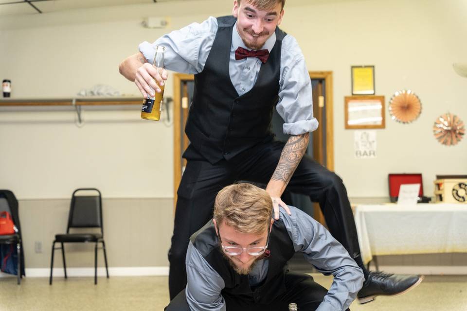 Groomsmen jumping over them