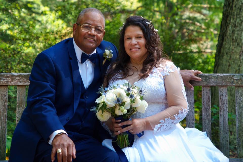 Bride and groom on bench