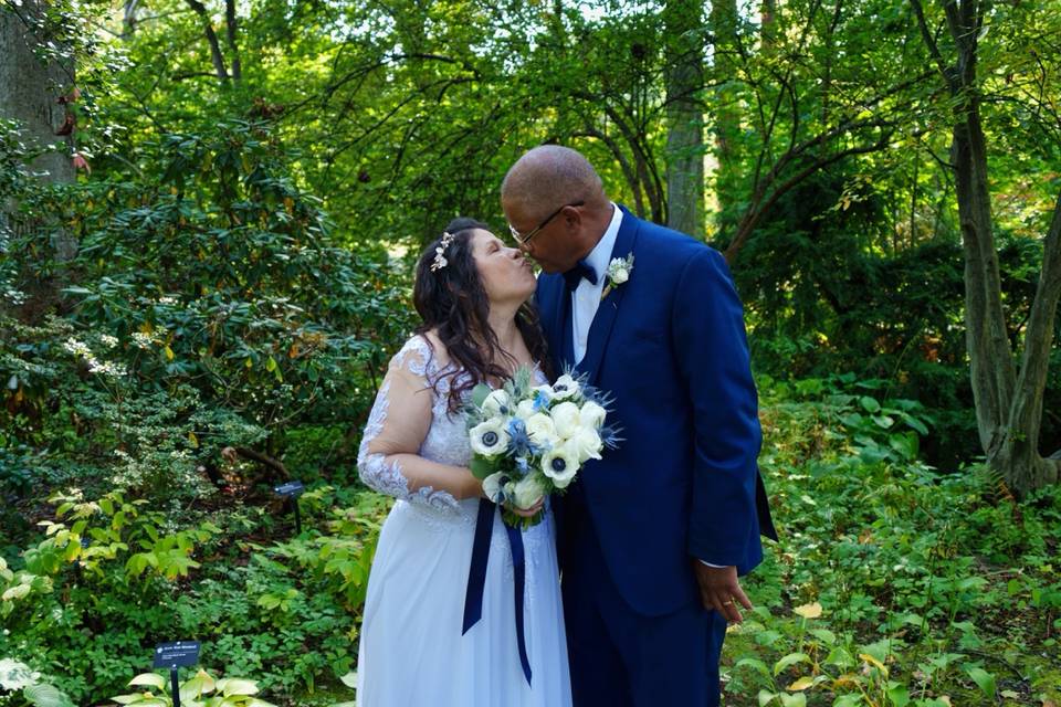 Bride and Groom Kiss in park