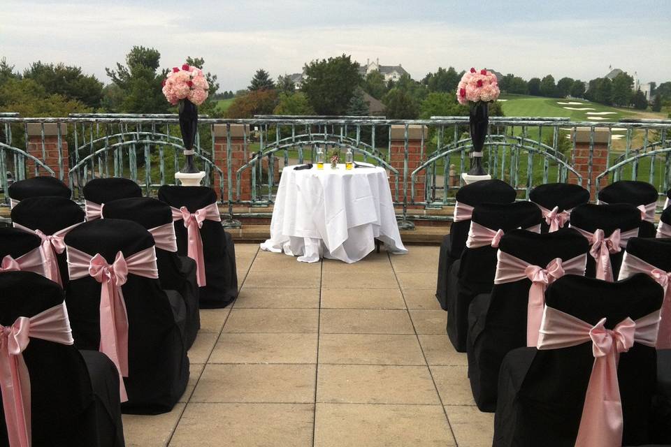 elegant black and pink outdoor ceremony site