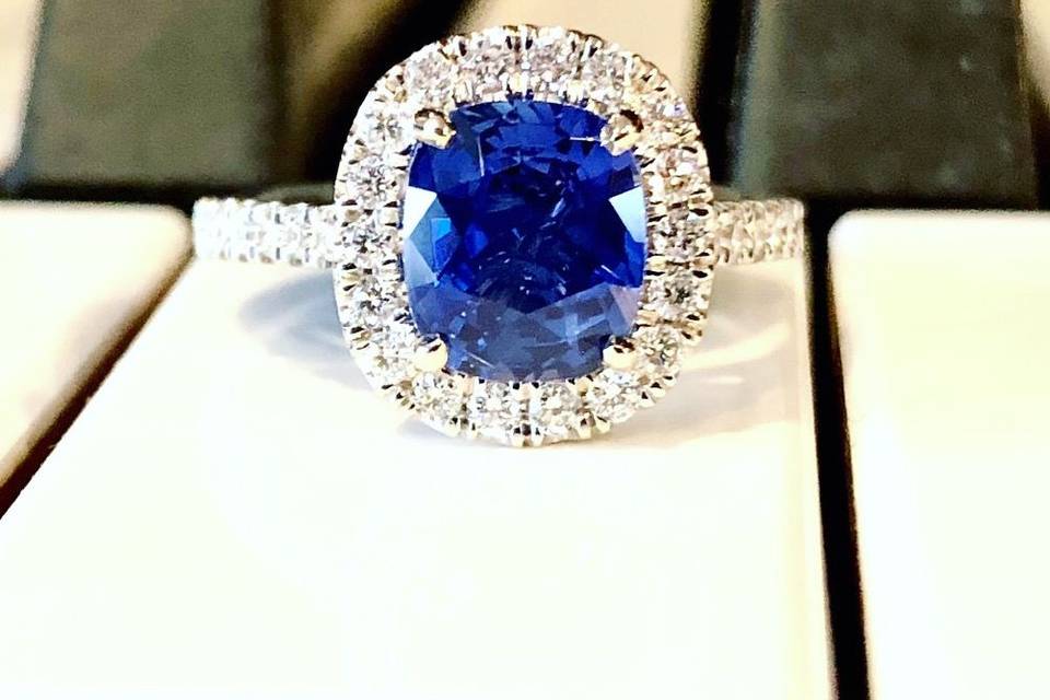 Ceylon Blue Sapphire surrounded by a diamond halo.