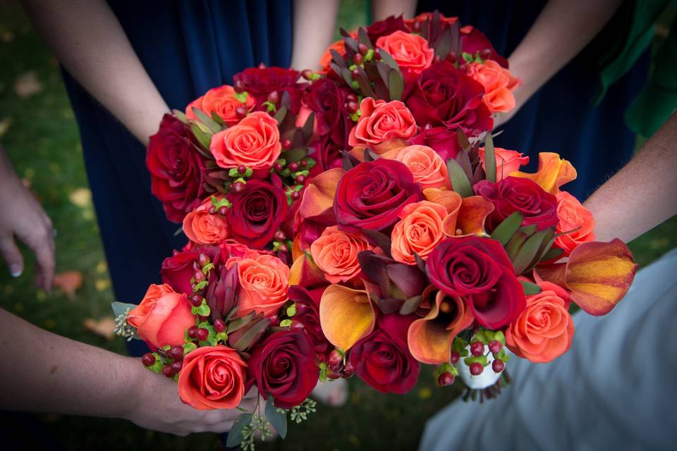 Bridal bouquet and bridesmaids' bouquets designed by L.A. Flowers, Inc.Beautiful photo taken by Lena Lee Photography - http://www.lenaleephotography.com