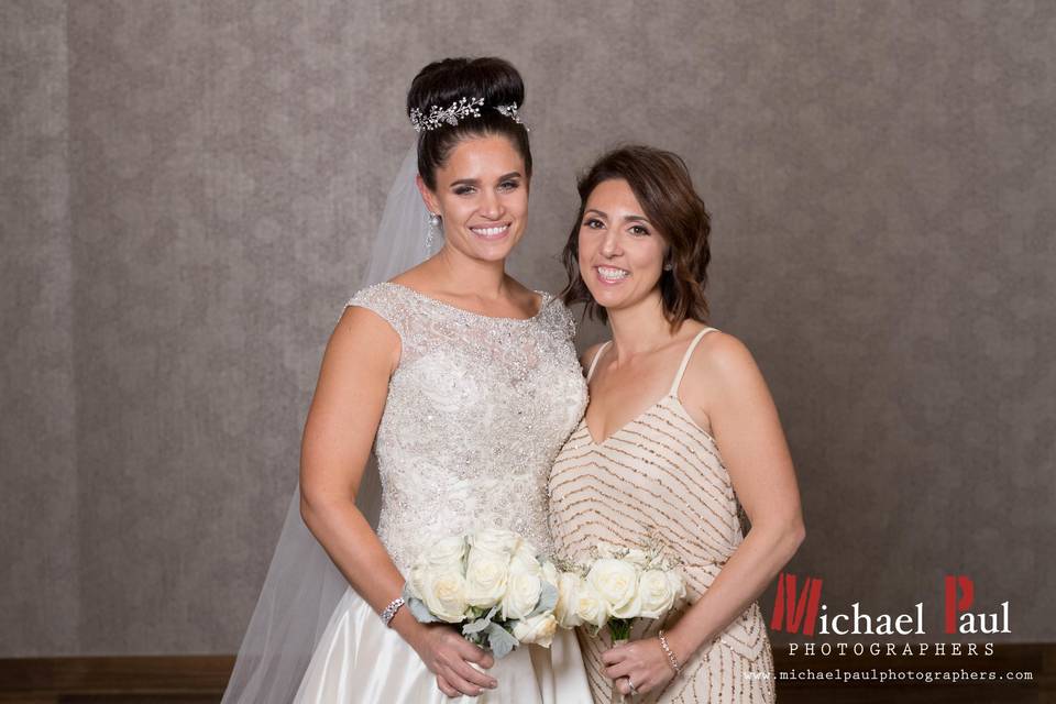 Bridal bouquet and bridesmaid's bouquet designed by L.A. Flowers, Inc.Lowes Chicago Hotel WeddingBeautiful photo taken by Michael Saukstelis of Michael Paul Photographers -http://www.michaelpaulphotographers