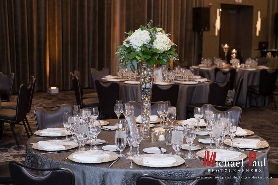 Large Reception Table Centerpiece designed by L.A. Flowers, Inc.Lowes Chicago Hotel WeddingBeautiful photo taken by Michael Saukstelis of Michael Paul Photographershttp://www.michaelpaulphotographers
