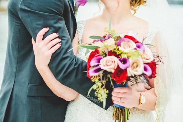 Bridal bouquet and boutonniere designed by L.A. Flowers, Inc. Whitetail Ridge Golf Club Wedding in Yorkville, IllinoisBeautiful Photo Taken by Julie Morrhttp://www.juliemorr.com