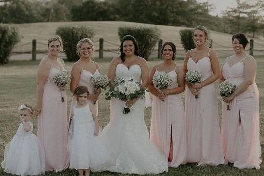 Bridal bouquet and bridesmaids’ bouquets designed by L.A. Flowers, Inc.Photo taken by Alexander Richie Photography.