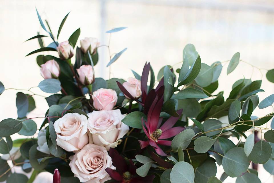 Wedding Reception Centerpiece designed by L.A. Flowers, Inc. Beautiful photo taken by Brooke Kristine PhotographyThe Acquaviva Winery