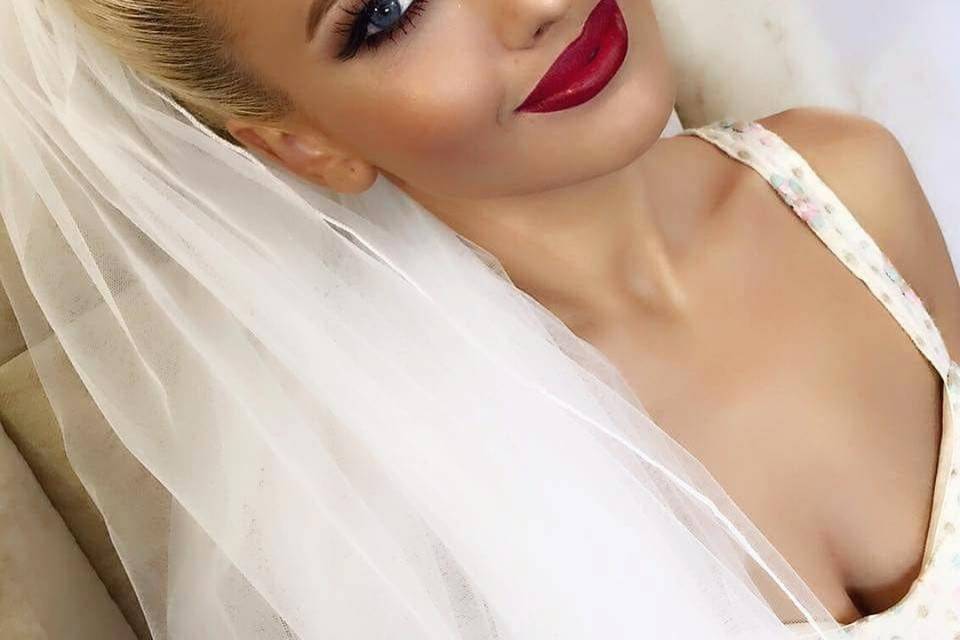 Bold red lip and strong eye makeup