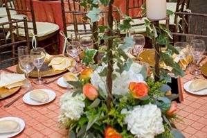 Low centerpieces with tiered pillar candles.