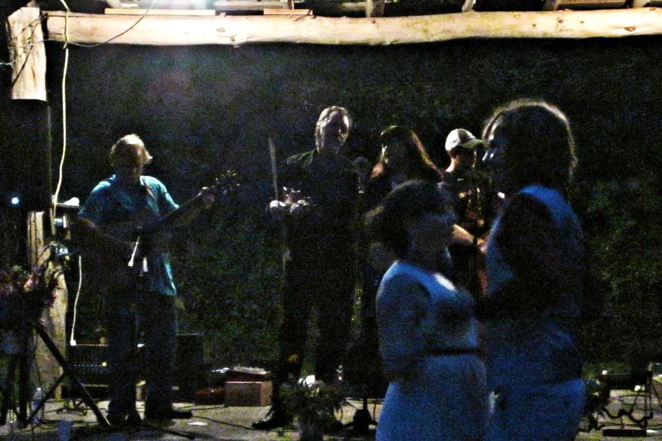 Evening dancing with bride and groom on a home made dance floor. They are dancing a two- step that they requested.