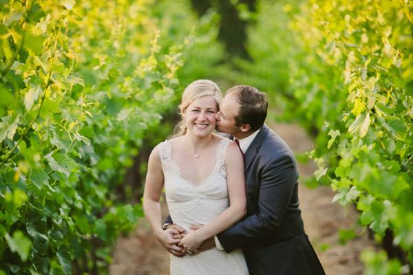 Couple embrace in the vineyard