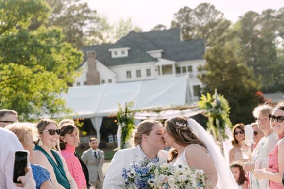 Bride in white suit