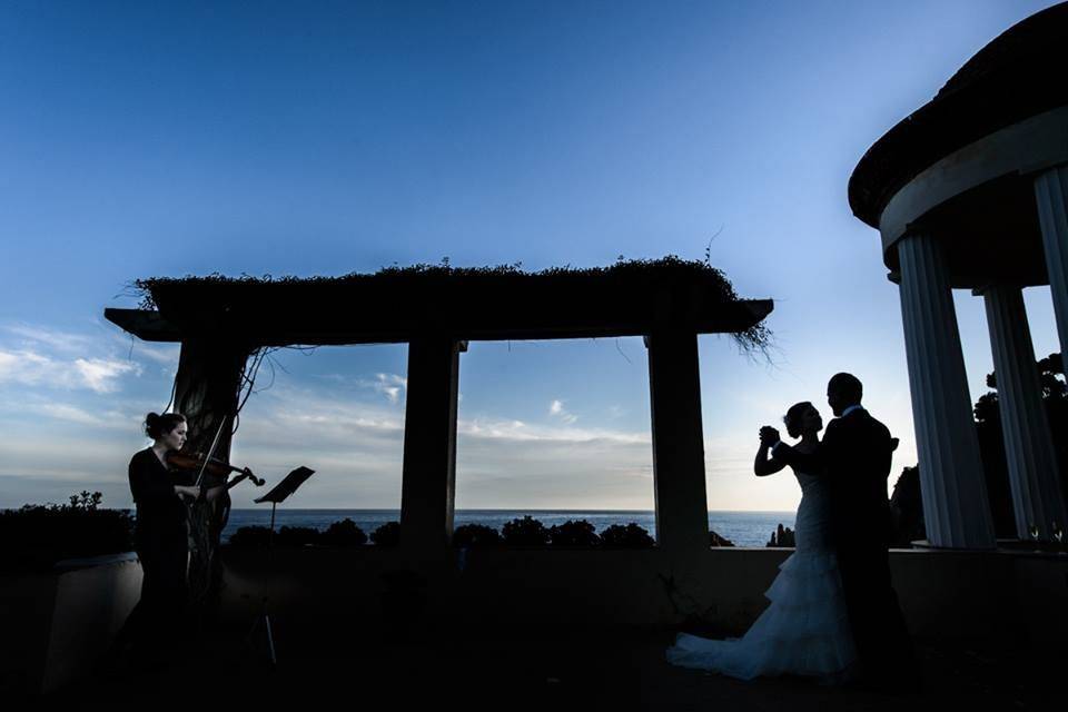 Couple dancing to violinist