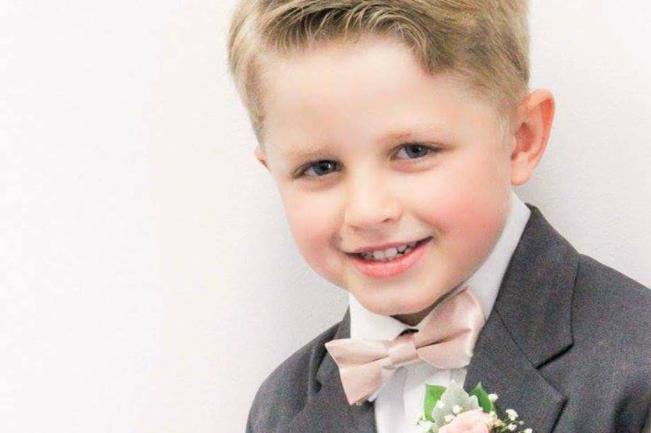 Ring bearer wearing his corsage