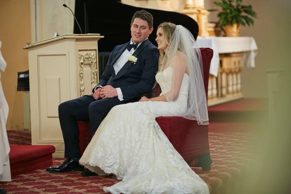 Bride and groom waiting in church