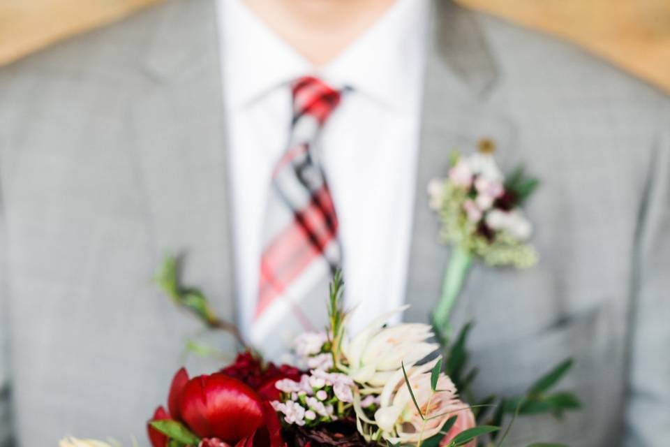 Groom holding bouquet