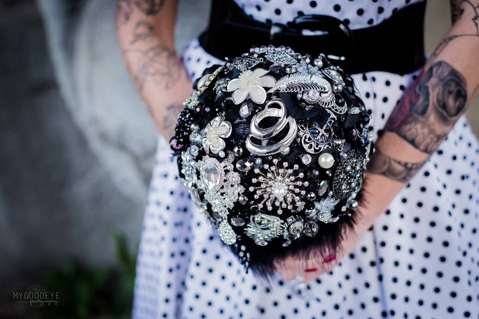 This black and silver brooch bouquet is currently on display at the St. Charles Antique Mall. It is also made with black feathers and silver jewelry new and vintage.
Photo by MGE Photography, St. Louis.
