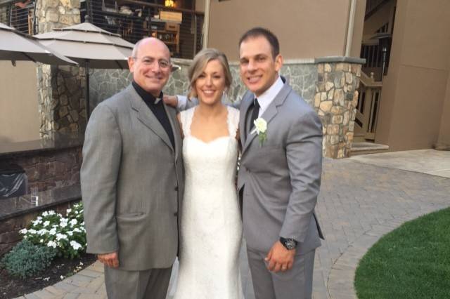 The couple with the officiant