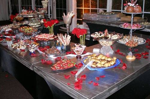 Desiree Chocolates provides a variety of bite-size desserts that your guests will love. The more variety, the better so you can try one of each! When you order the live dipping station, we will dip fresh fruits right at the event. Nothing can be more delicious than a freshly dipped strawberry - YUM! The above selection includes (from left to right) white chocolate popcorn, chocolate caramel apples, fresh fruit kebabs, dipped pretzel rods, wafer rolls, red velvet cupcakes, toasted coconut cups, chocolate strawberry “ladybugs” (the bride loves ladybugs so we created a chocolate strawberry to resemble a ladybug) , caramel shortbread squares and chocolate drizzled cream puffs.
