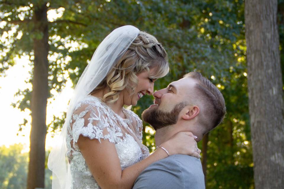 Groom picking up bride