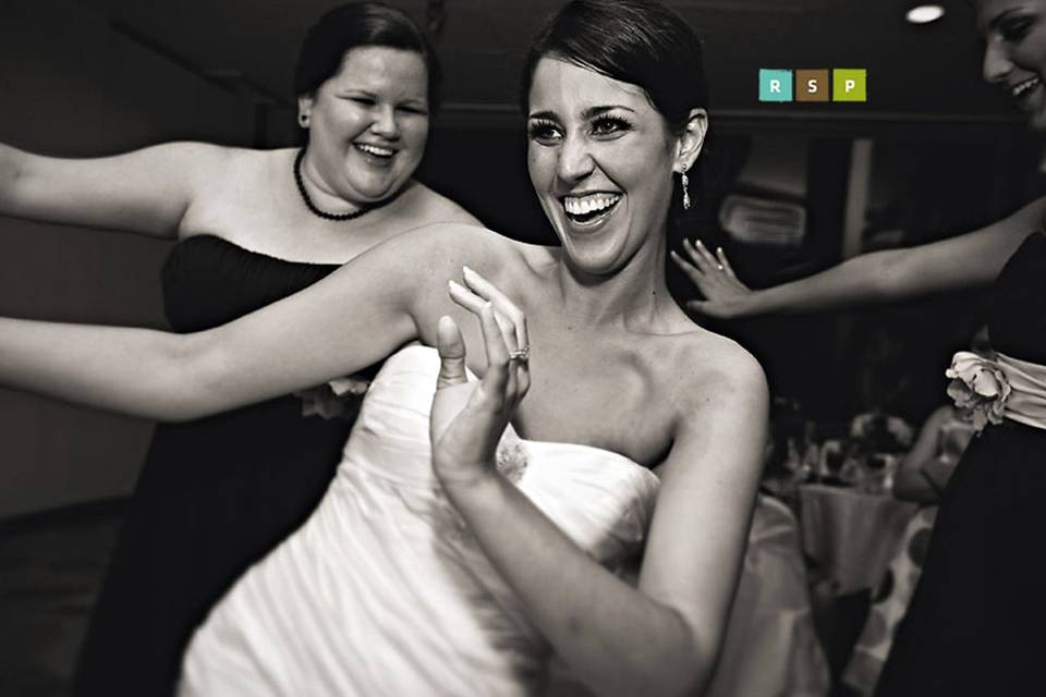 Bride and her bridesmaids dancing